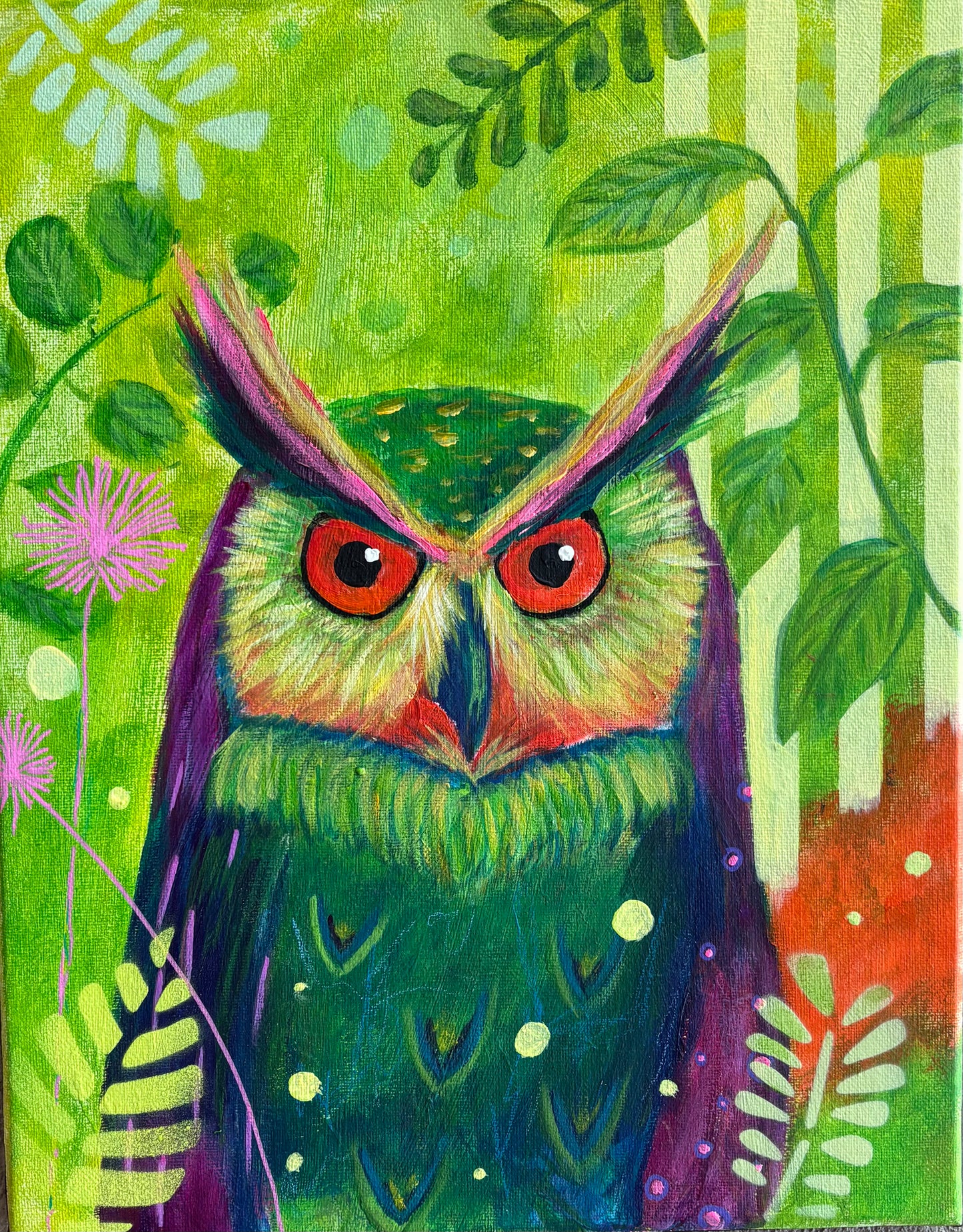 A vibrant and whimsical owl set against a lush, nature inspired background. With bold and saturated colours, its feathers blending shades of green, purple, and teal, and striking eyes give it an intense almost mystical expression.&nbsp;